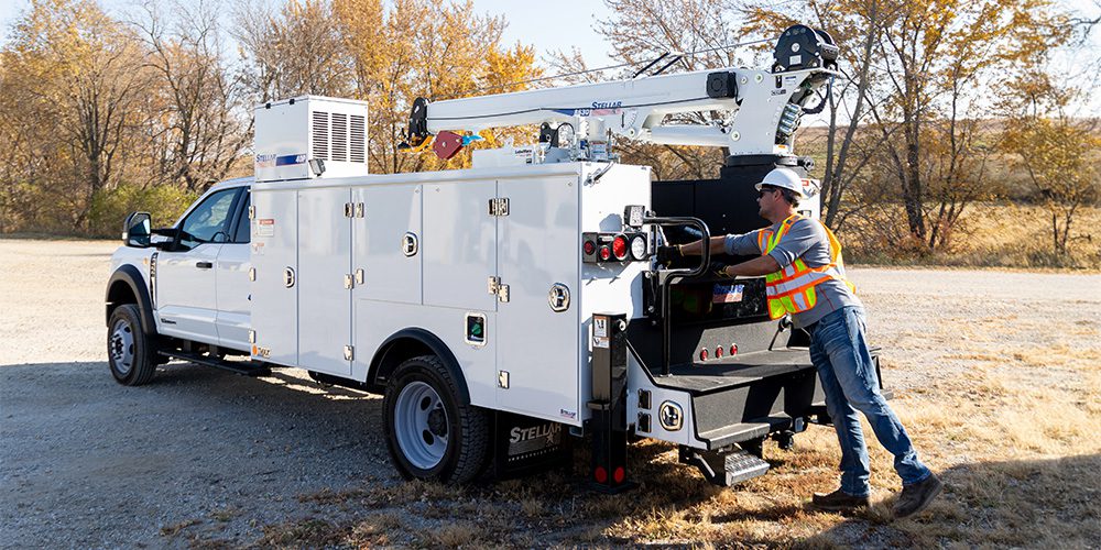 A technician using a lube skid on a Stellar TMAX 1.
